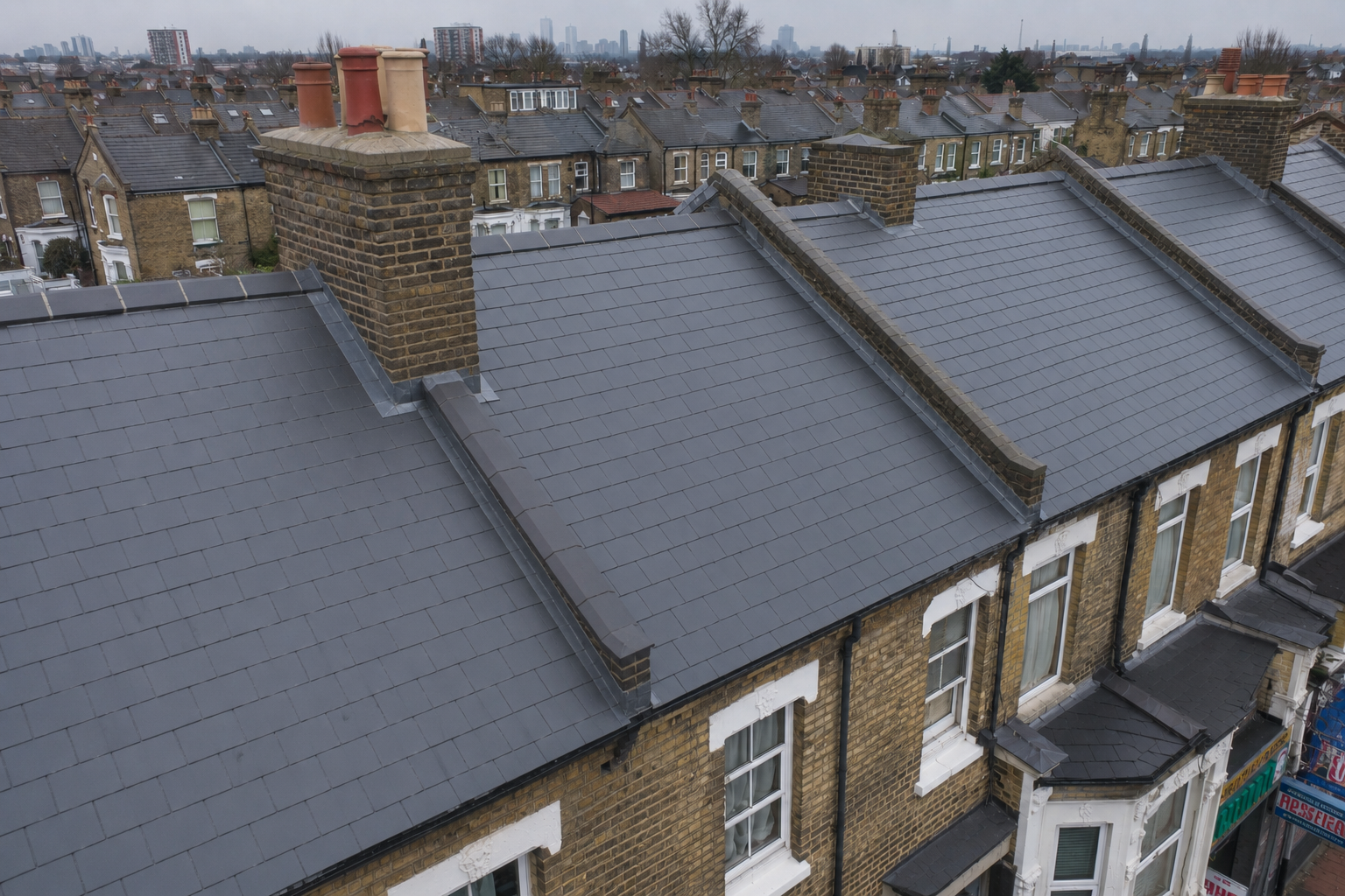 After photo showing perfectly restored and weatherproofed roof on the same Victorian terrace in East Ham, Newham — completed by Obsidian Roofing specialists