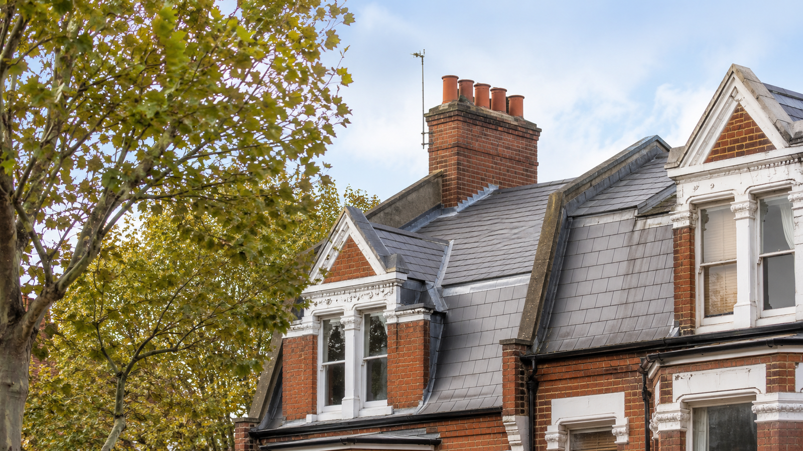 A beautifully restored Victorian slate roof on a terraced property in Belsize Park NW3 showing authentic Welsh slate tiles and traditional lead flashing details expertly installed by roofing Belsize Park specialists.